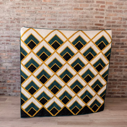 Decorative rug with geometric pattern in front of a brick wall